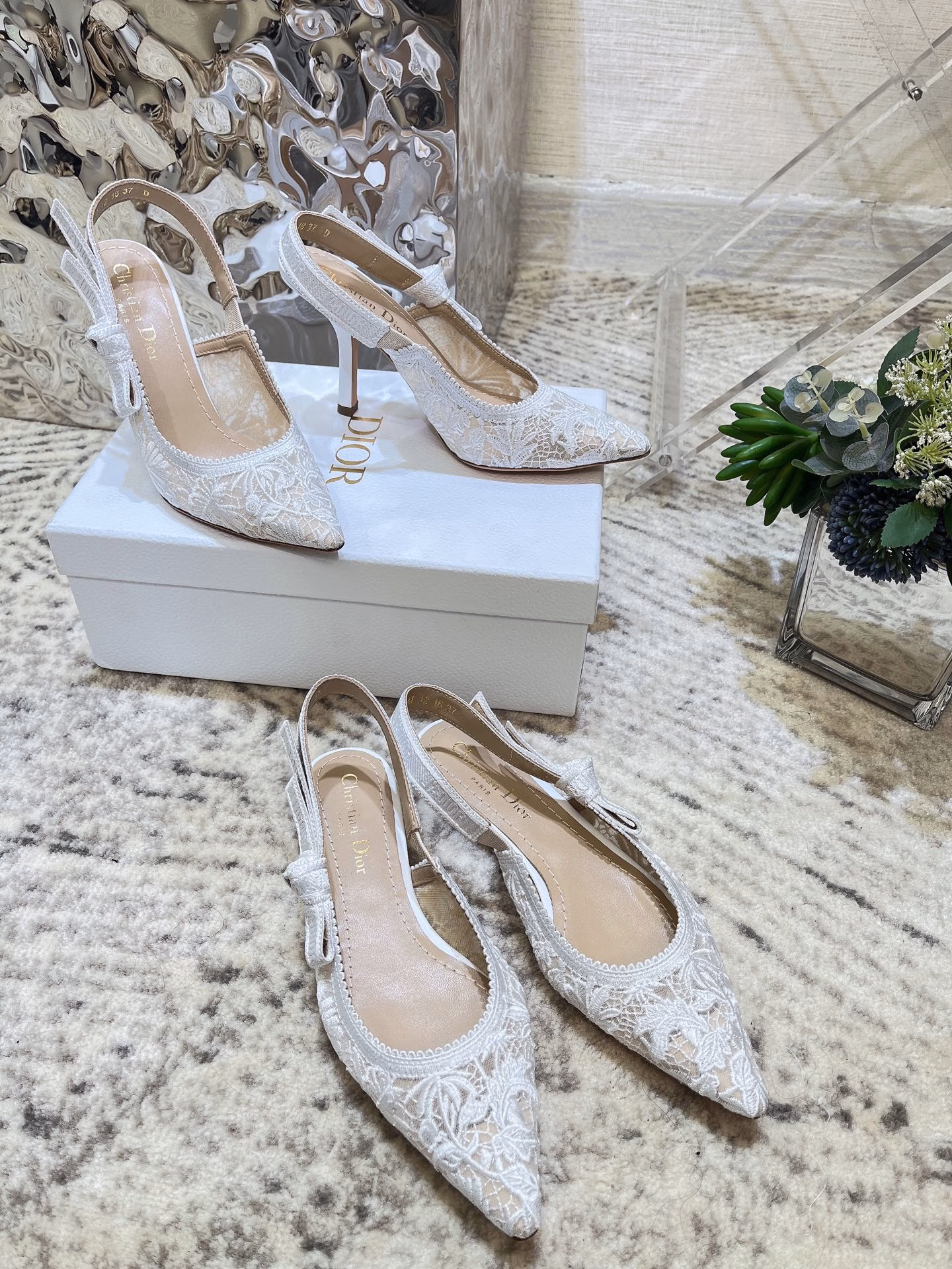 ✨The J’Adior slingback pump is a perfect example of Dior’s savoir-faire. Crafted in the Italian workshops of Christian Dior, it is crafted from materials such as transparent mesh and embroidered with the Dior Chardons motif designed by Pietro Ruffo in black cotton thread, showing the Scottish national flower, which symbolizes protection, resilience and freedom. The J’Adior two-tone embroidered band is embellished with a flat bow and is paired with a 1.0 cm, 6.5 cm and 10 cm comma heel for an elegant and sophisticated look. Pair with other pieces from the Dior Chardons collection.