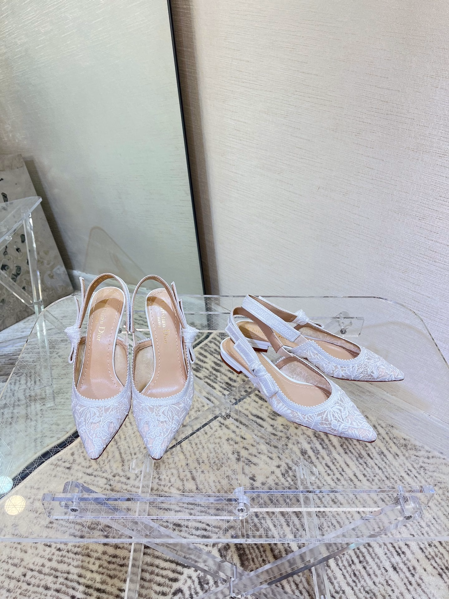 ✨The J’Adior slingback pump is a perfect example of Dior’s savoir-faire. Crafted in the Italian workshops of Christian Dior, it is crafted from materials such as transparent mesh and embroidered with the Dior Chardons motif designed by Pietro Ruffo in black cotton thread, showing the Scottish national flower, which symbolizes protection, resilience and freedom. The J’Adior two-tone embroidered band is embellished with a flat bow and is paired with a 1.0 cm, 6.5 cm and 10 cm comma heel for an elegant and sophisticated look. Pair with other pieces from the Dior Chardons collection.