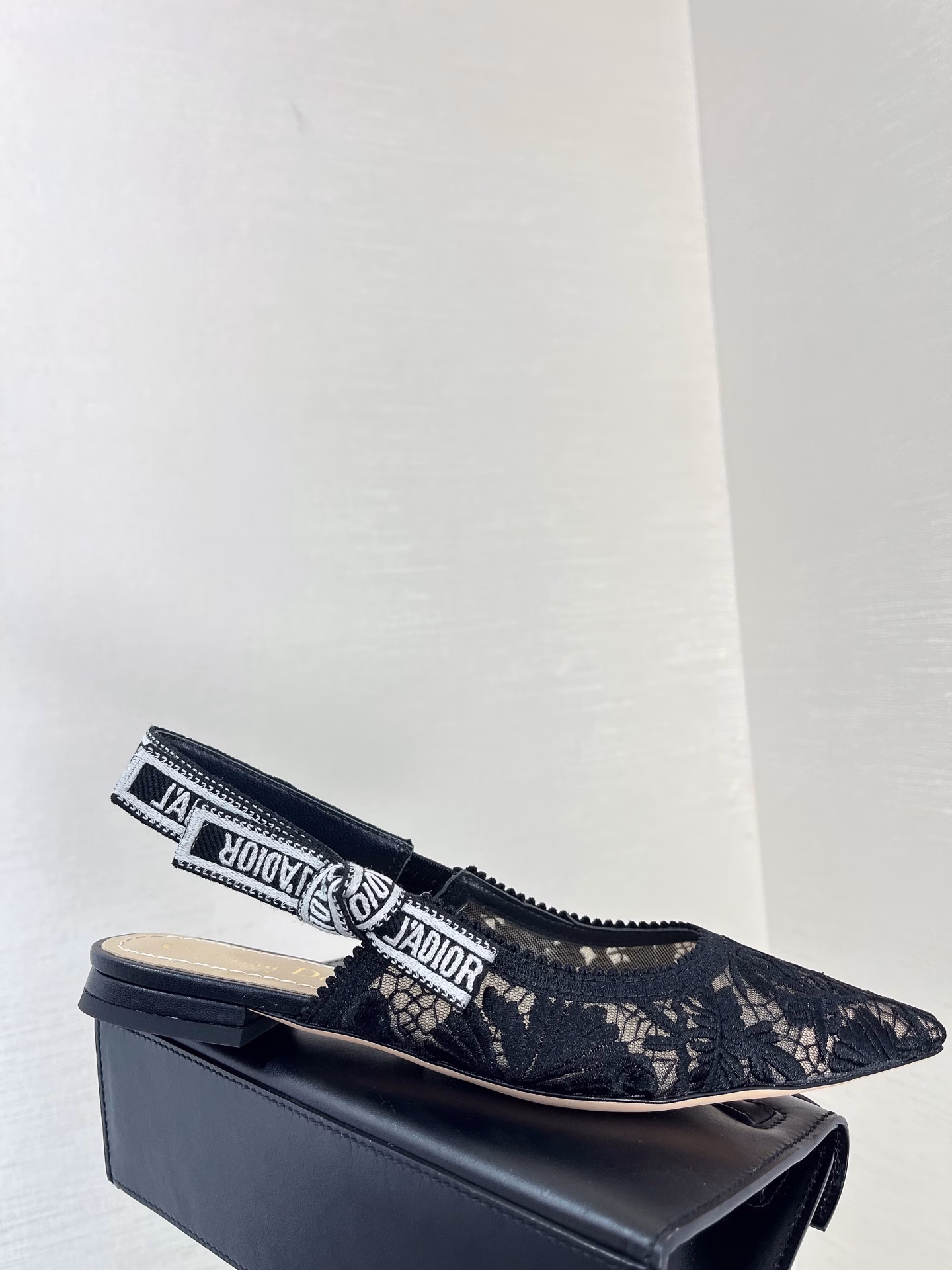 ✨The J’Adior slingback pump is a perfect example of Dior’s savoir-faire. Crafted in the Italian workshops of Christian Dior, it is crafted from materials such as transparent mesh and embroidered with the Dior Chardons motif designed by Pietro Ruffo in black cotton thread, showing the Scottish national flower, which symbolizes protection, resilience and freedom. The J’Adior two-tone embroidered band is embellished with a flat bow and is paired with a 1.0 cm, 6.5 cm and 10 cm comma heel for an elegant and sophisticated look. Pair with other pieces from the Dior Chardons collection.