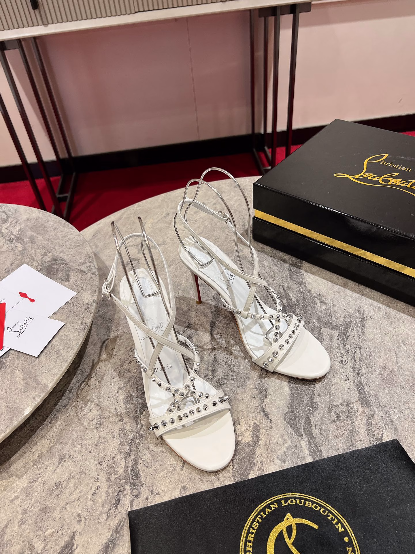 Tatooshka Spikes is an elegant leather sandal with a 100mm stiletto heel and a gently curved arch. The thin straps cross the foot, wrap around the ankle and showcase the scattered Maison Christian Louboutin signature spikes on the front strap. The signature Loubi red sole contrasts with the Bianco white leather sole, while the almond-shaped toe creates a stylish finish.