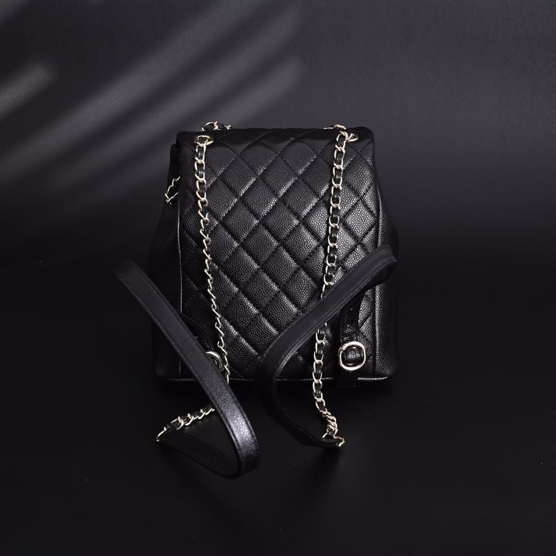 Chanel Duma 24A Retro Light Gold Buckle Diamond PatternLychee Pattern Cowhide - Backpack Medium - Unisex Couple Style Black! I fell in love with this bag at first sight! I love this luxury and low-key, fashionable and practical. In every detail, it reveals a unique artistic charm and design concept. At first glance, the design of this backpack is simple and atmospheric, but unique design elements are injected into every corner, which makes people stop and appreciate it. …Its capacity is large enough to hold, but it will not look bulky, so that you can meet your daily needs while pursuing fashion. Whether it is work or leisure, this backpack can make you cope with it easily. It is not only a bag, but also your fashion label. It can perfectly set off your temperament and make you shine in any occasion. Owning this backpack is like having a secret weapon that can make you shine in any occasion.