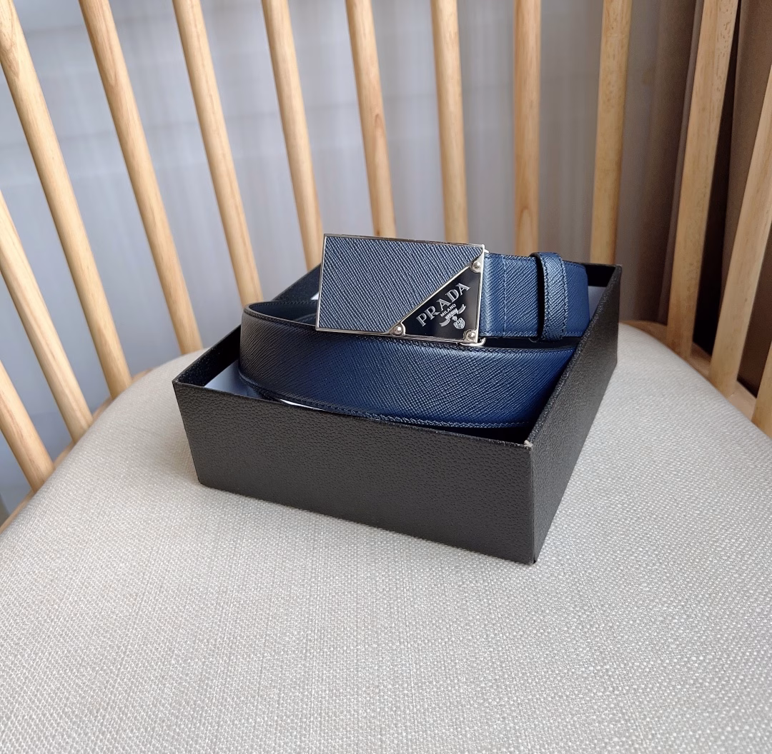 The latest model from PRADA This versatile accessory features a simple yet sophisticated design The elegant Saffano leather with cross-line texture adds a subtle touch The iconic metal lettering logo embellishes the buckle