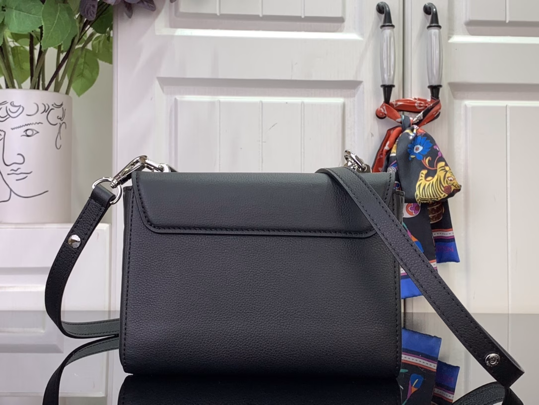 Inspired by the monogram flower, this Twist PM slim bag from the Harmony collection stands out with its decorative chain. Made of Taurillon leather, it features the iconic LV twist lock and is coated with resin to create a tone-on-tone finish. This perfect model for any occasion has numerous pockets and a removable mirror.