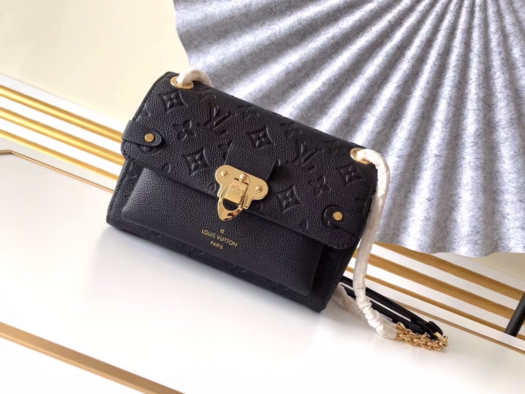 Made from a mix of smooth and embossed Monogram Empreinte leather, this small Vavin bag features a shiny, eye-catching lock design. Soft and lightweight, stylish and casual, an easy choice for everyday carry. With an adjustable leather chain strap, it can be carried on the shoulder or across the body.