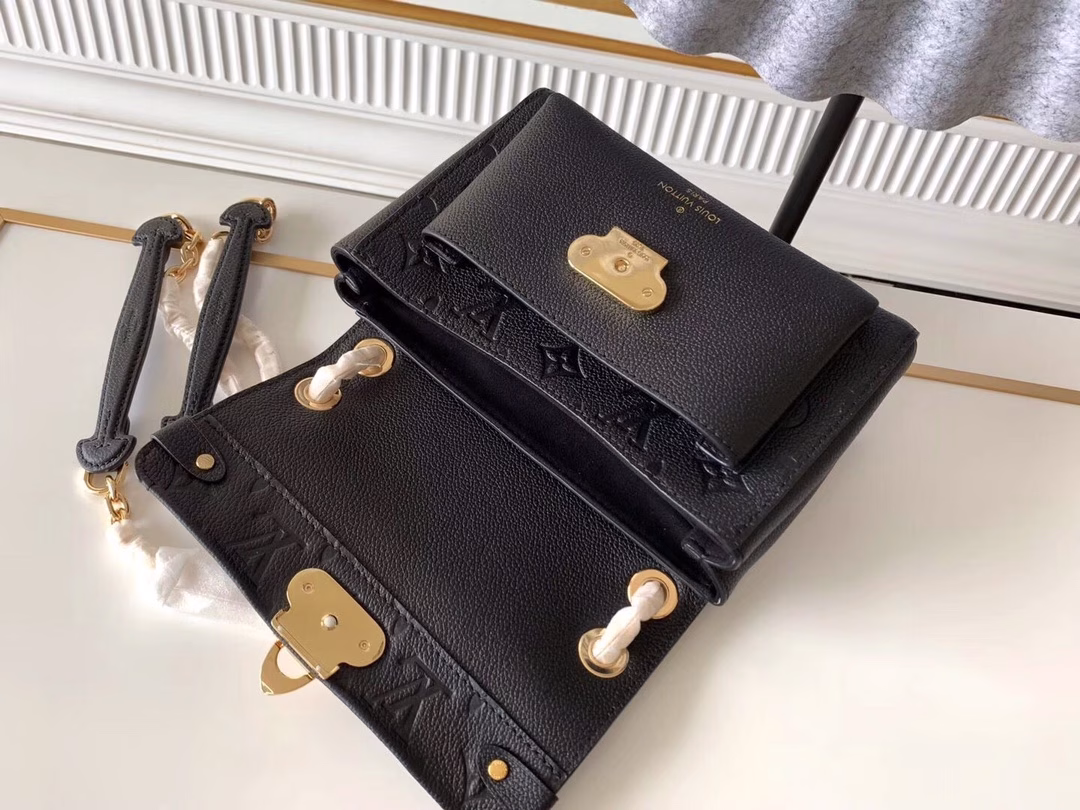 Made from a mix of smooth and embossed Monogram Empreinte leather, this small Vavin bag features a shiny, eye-catching lock design. Soft and lightweight, stylish and casual, an easy choice for everyday carry. With an adjustable leather chain strap, it can be carried on the shoulder or across the body.