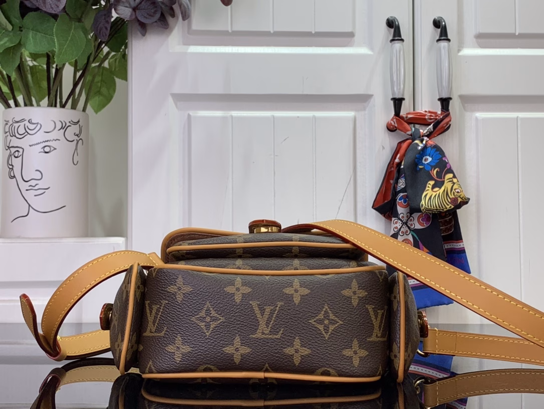 This Cargo Mini Bag is from the Monogram Archive collection, using soft Monogram coated canvas to create an urban configuration, and then conveying a vintage feel with distressed cowhide leather trims and dazzling metal parts. The main compartment, open front pocket and open side pockets highlight functional considerations, and the detachable and adjustable shoulder strap allows for shoulder or crossbody experience.