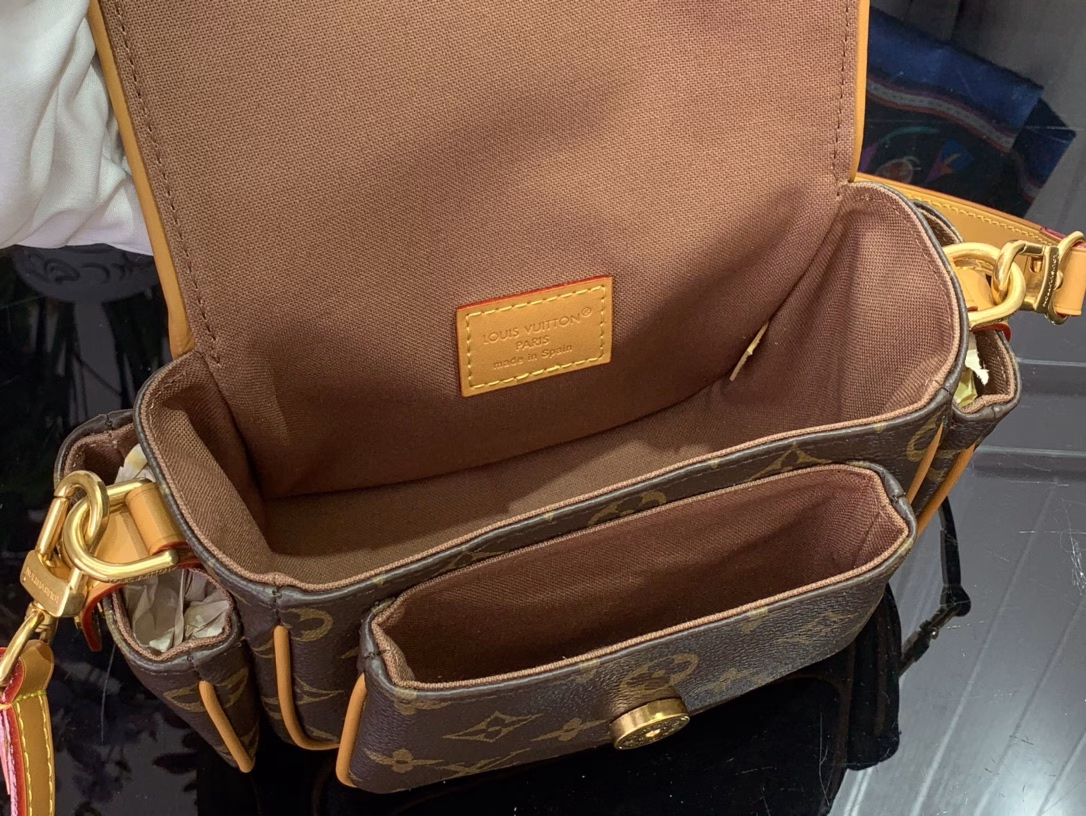 This Cargo Mini Bag is from the Monogram Archive collection, using soft Monogram coated canvas to create an urban configuration, and then conveying a vintage feel with distressed cowhide leather trims and dazzling metal parts. The main compartment, open front pocket and open side pockets highlight functional considerations, and the detachable and adjustable shoulder strap allows for shoulder or crossbody experience.