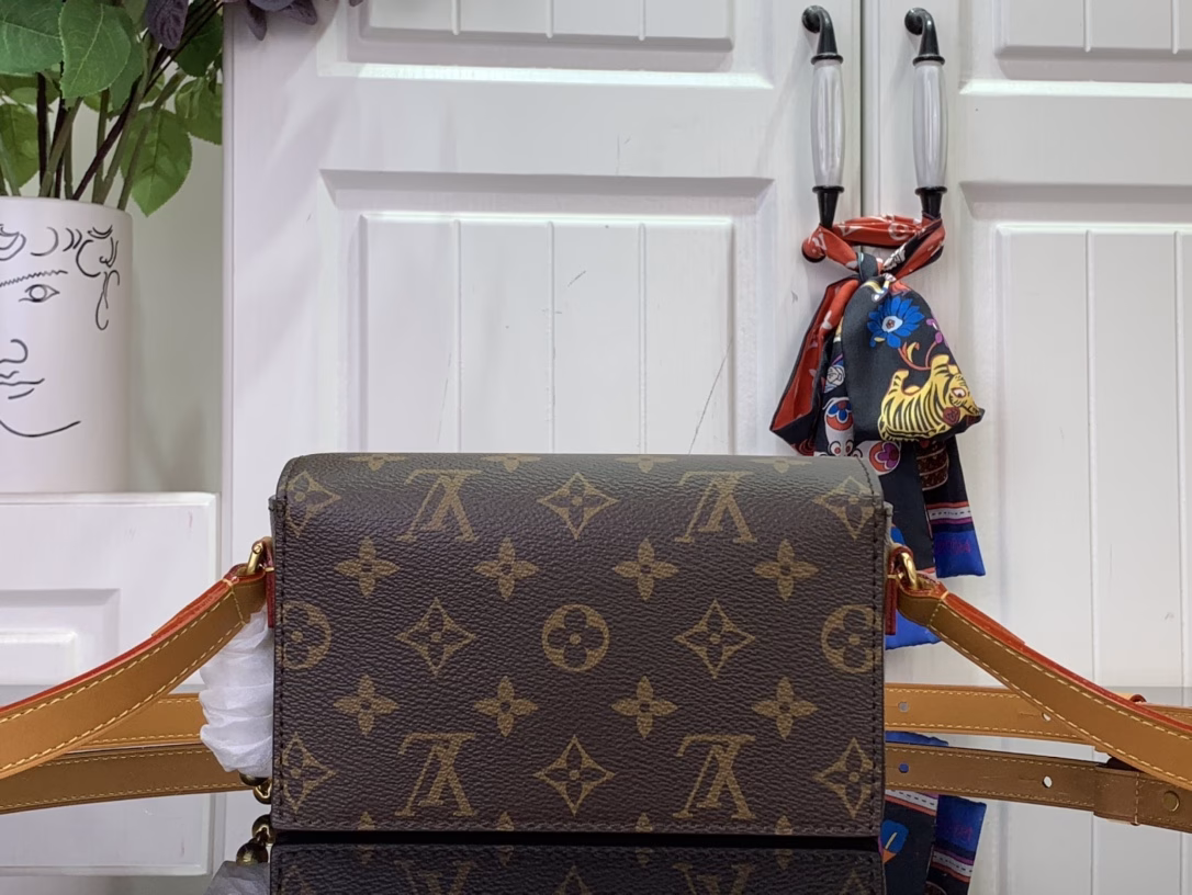 The Steamer Mini Bag is crafted from Monogram canvas with distressed calfskin trim and striking hardware. The new square lock recalls Pharrell Williams' signature Damier motif, the delicate key connects to the delicate bead chain, and the adjustable strap allows for shoulder and crossbody wear.