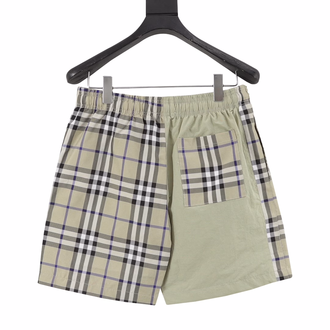 Burberry classic oblique plaid patchwork beach shortsThe style is stylish and fashionable for everyone. The back pocket is decorated with equestrian knight logo applique embroidery, which is low-key and luxurious. The imported fabric is light and delicate. The classic elastic waist style is versatile and makes the upper body look slim and tall.