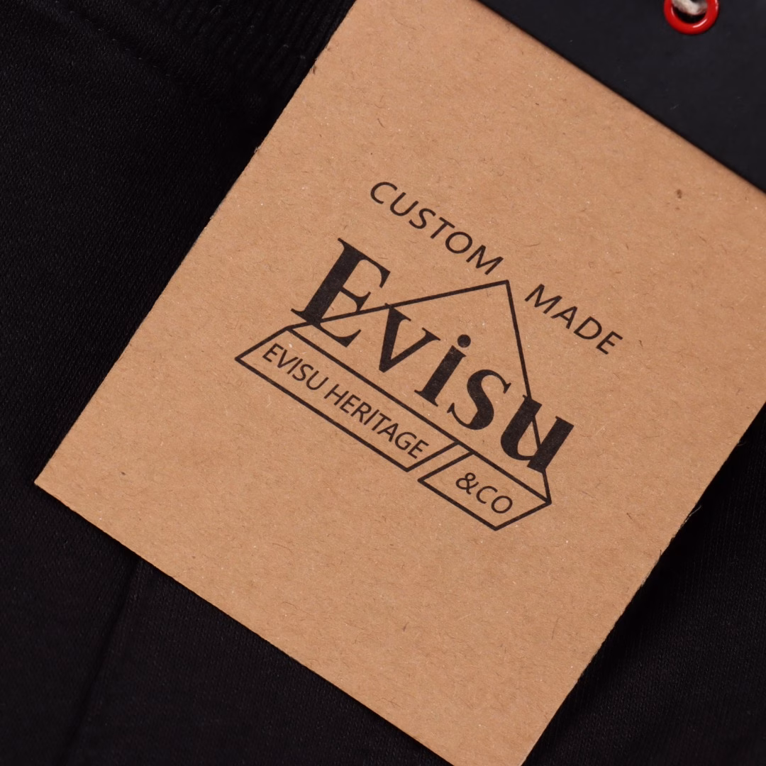 EVISU Billion Fishing Prayer Print ShortsThe large M print on the back of the shorts is based on the Japanese fishing prayer festival, and incorporates various Japanese origin objects, fortune-bringing balls, flags and other prints, making the overall playfulness more interesting. Pair it with a top to create your own trendy style.Elastic drawstring waistband makes it easier to put on and take off