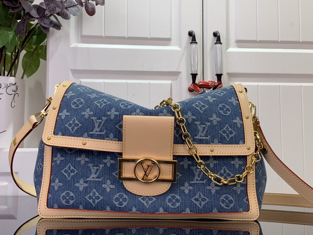 The Dauphine Soft Large Bag reinterprets a classic silhouette in Monogram denim, with the LV initials, a removable chain and adjustable leather shoulder strap for a sophisticated design that complements the calfskin trim. The zipped interior pocket keeps small items secure.