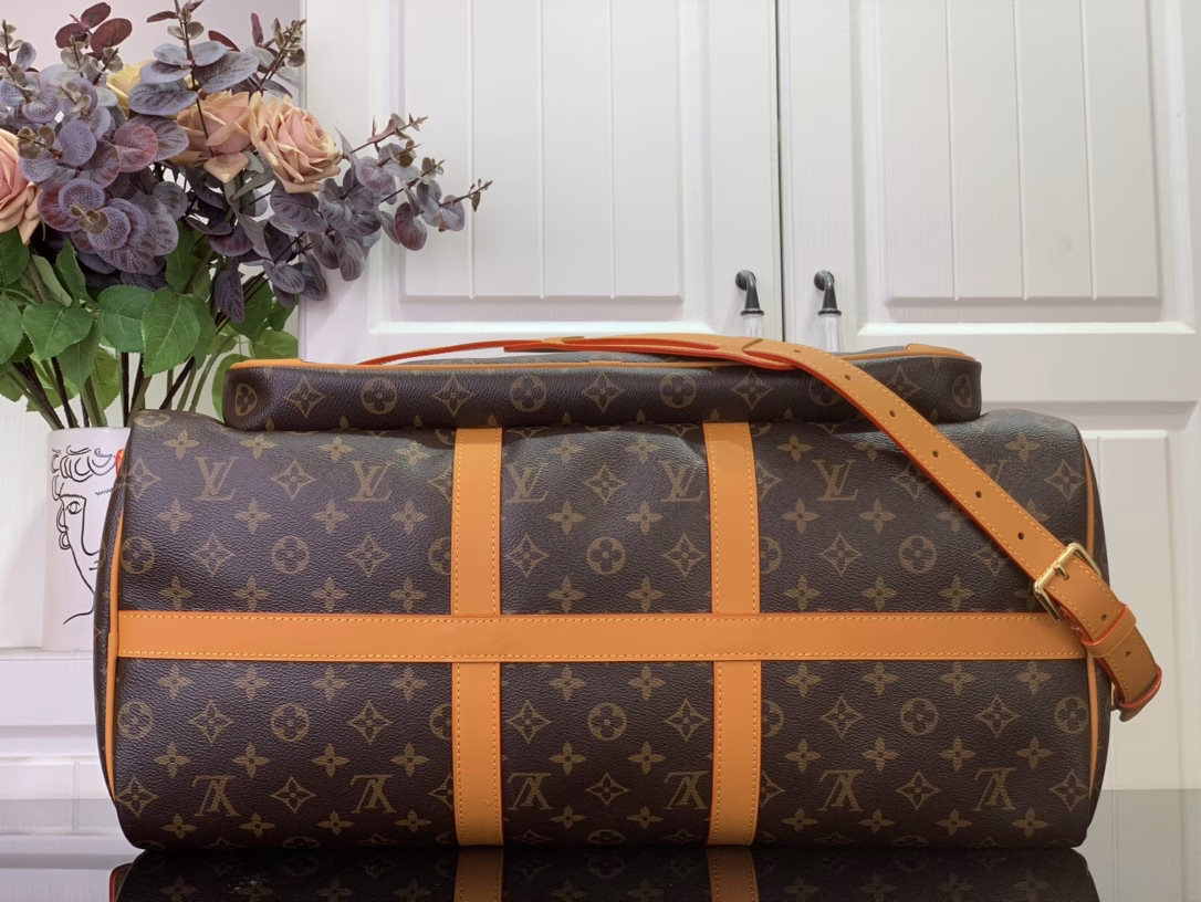 The Keepall Cargo 50 is a modern nod to the House's iconic design from the Monogram Archive collection. Made from Monogram coated canvas, it features distressed calfskin trims and striking hardware, while the main compartment and front pocket zipper pulls are embellished with metallic beads, a nod to Pharrell Williams's latest twist.
