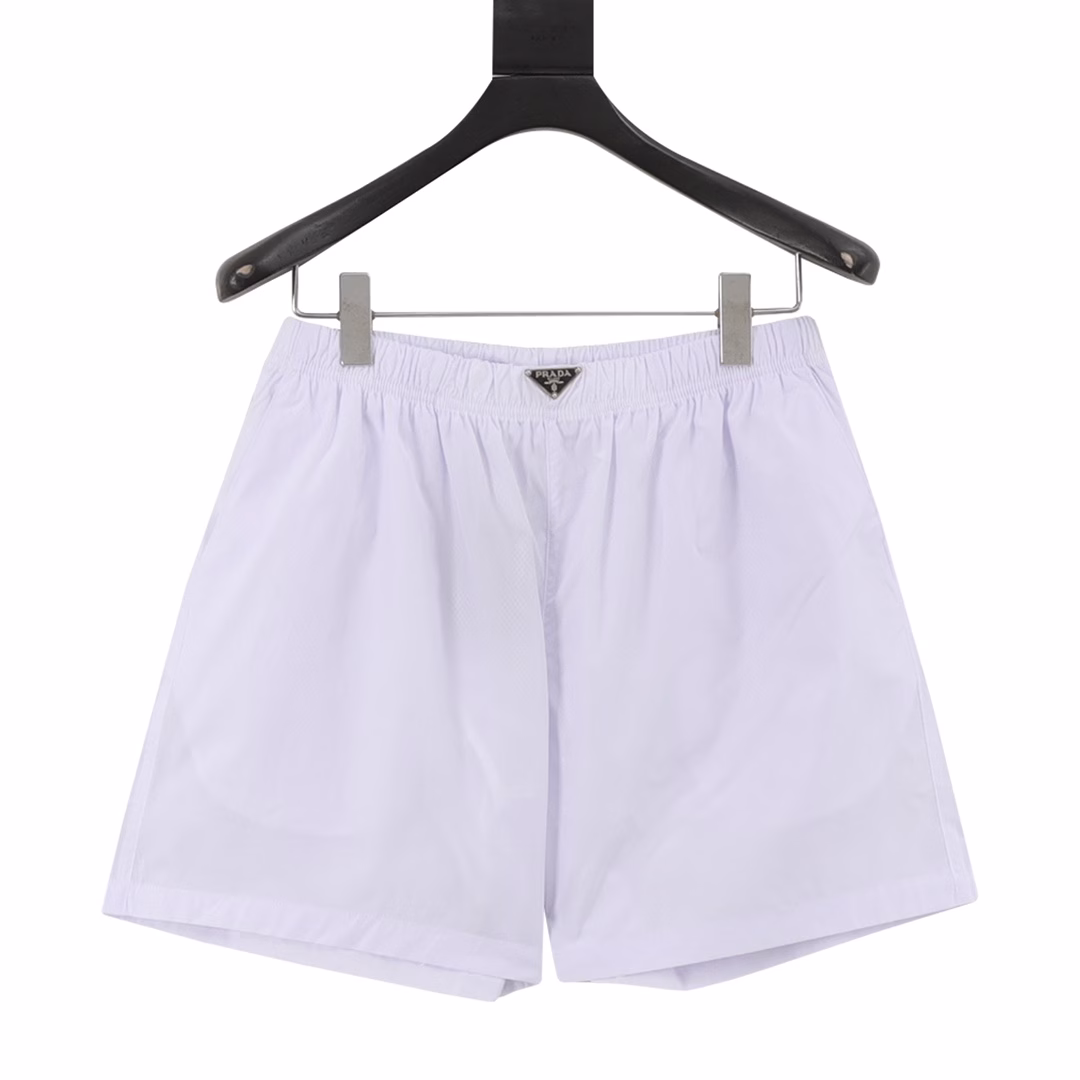 Prada 25ss waist triangle logo beach shortsUsing technical nylon waterproof fabric, thin as a cicada's wing, cool texture, mesh gauze lining, double-layer stitching, metal triangle brand logo nameplate, casual and comfortable, high quality, both colors are recommended
