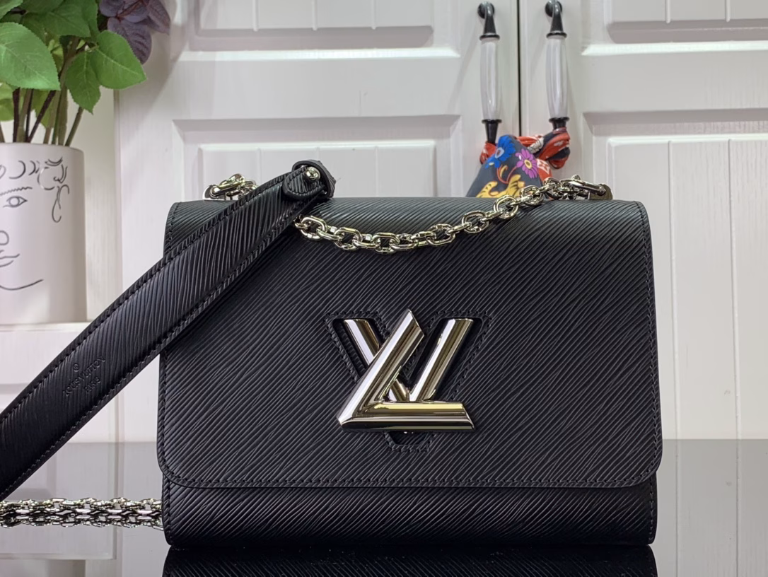 The Twist Medium Bag is crafted in iconic Epi grain leather in a striking new color for summer. The leather lining creates contrast and the sliding chain strap is padded with leather for comfortable shoulder and crossbody wear.