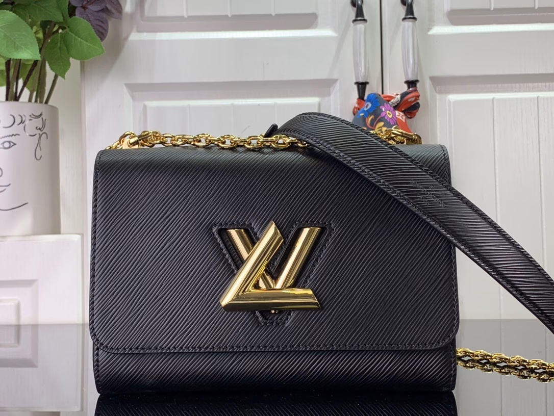The Twist Medium Bag is crafted in iconic Epi grain leather in a striking new color for summer. The leather lining creates contrast and the sliding chain strap is padded with leather for comfortable shoulder and crossbody wear.