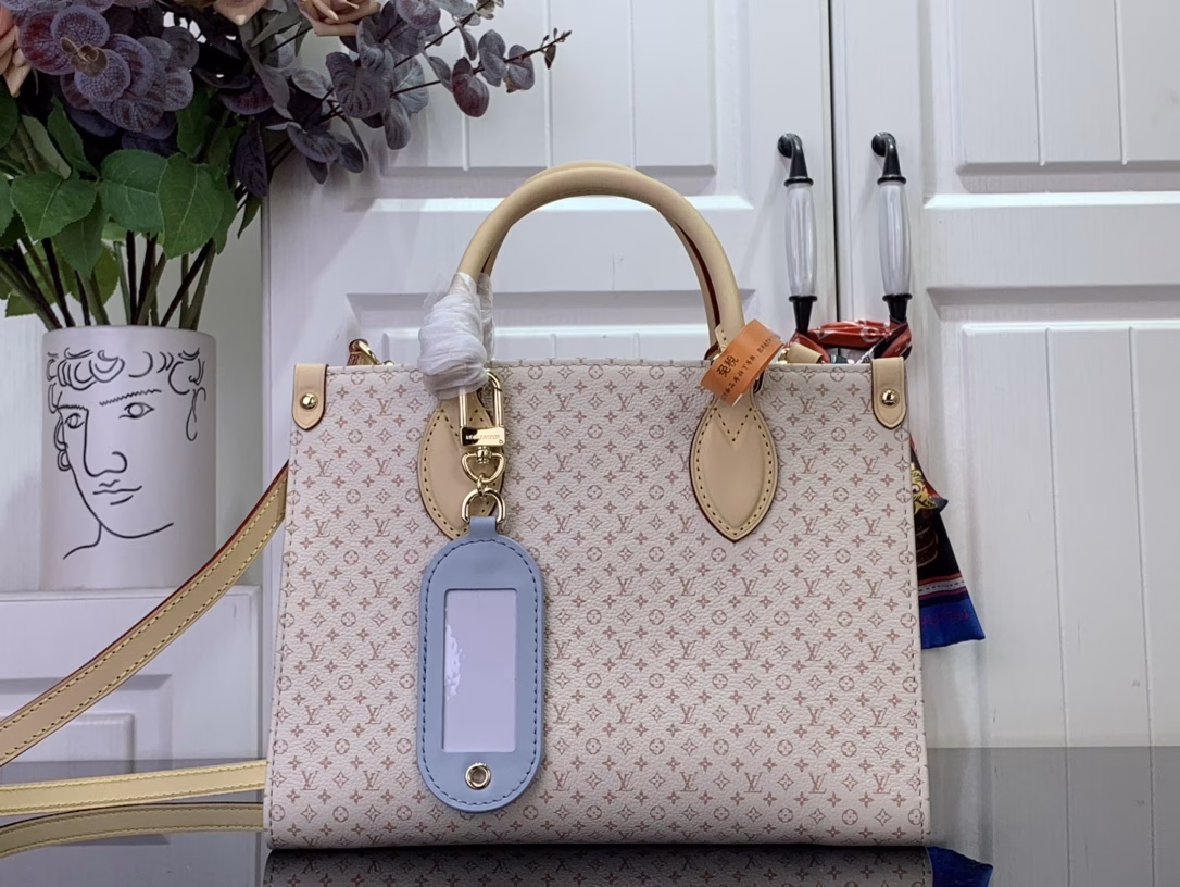 Part of the LV Romance collection, the OnTheGo PM is a unique combination of the brand's iconic Daumier and tag names, adding a splash of colour to the season. Crafted from calfskin, this elegant handbag features a playful luggage tag charm and includes a mirror, ideal for applying make-up. Attach the longer strap to wear it on your body.