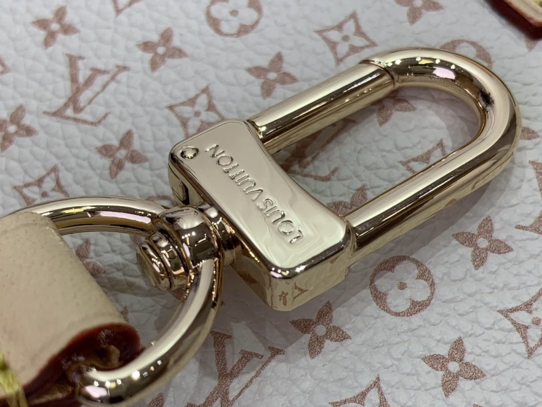 Part of the LV Romance collection, the OnTheGo PM is a unique combination of the brand's iconic Daumier and tag names, adding a splash of colour to the season. Crafted from calfskin, this elegant handbag features a playful luggage tag charm and includes a mirror, ideal for applying make-up. Attach the longer strap to wear it on your body.