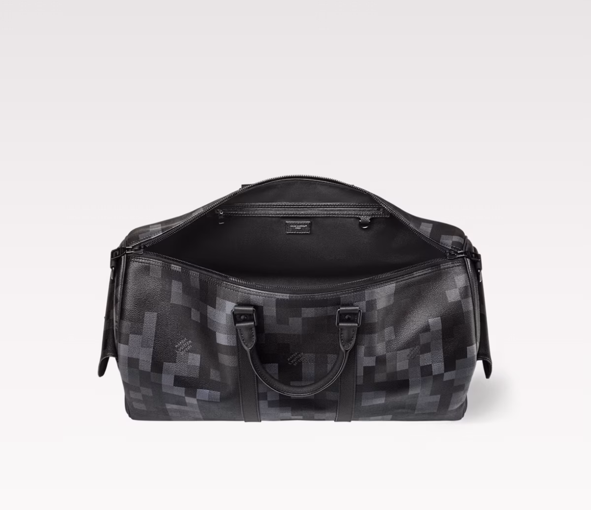 Made from Damoflage Black coated canvas, it features a pixelated Damier check pattern created by Pharrell Williams. The deep hue creates a modern look, while the top handle and removable, adjustable shoulder strap allow for versatile carrying.