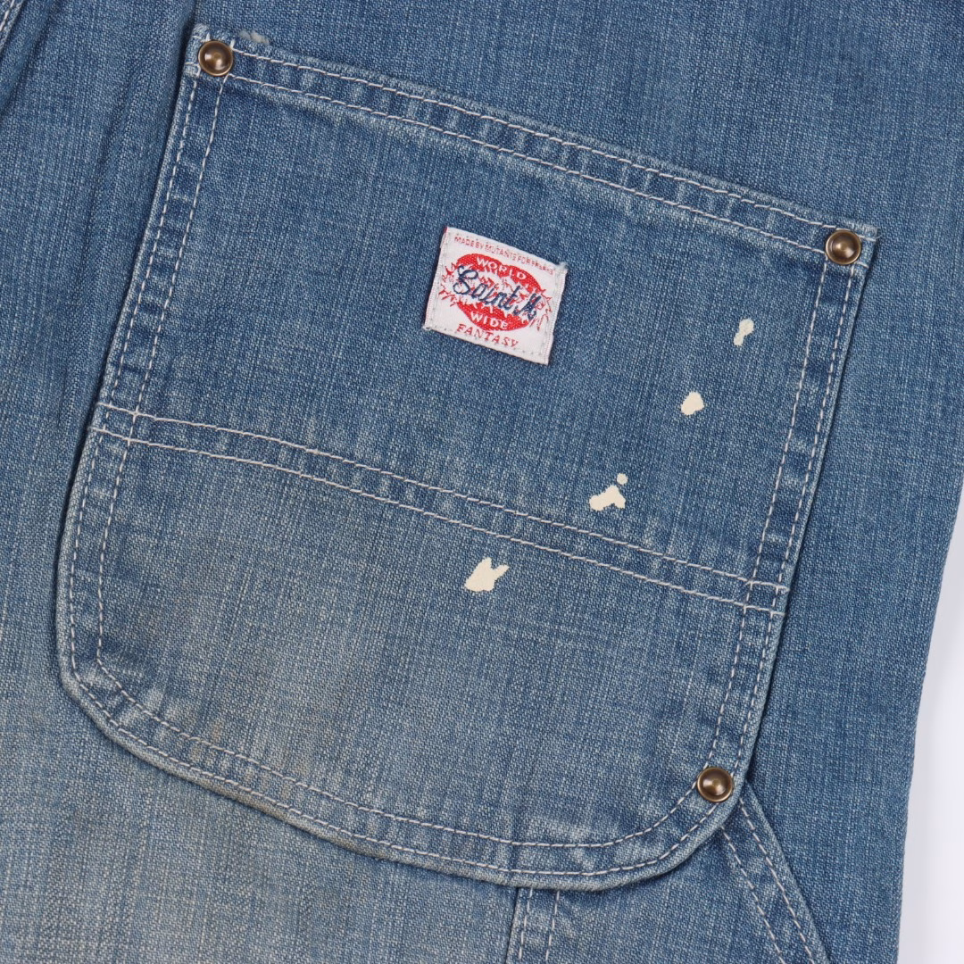 SAINT MICHAEL 25SS Splashed ink fringed logging Denim shortsThe entire pair of trousers is made of 430g 100% pure cotton 15-ounce cyrown denim fabric. The production process of this pair of trousers is more expensive than that of previous trousers. There are too many parts that need to be washed and aged. The re-washing water is used for a chestnut fading treatment to create local mottled fading. The front piece is designed with a practical large pocket, and the edges are reinforced with metal rivets. The deep blue denim base is freely decorated with white ink patterns The feet create a casual and retro artistic feel. The edges are not locked, and the rough edges are treated to drape naturally. It is not a deliberate mess but an unadorned and genuine sense