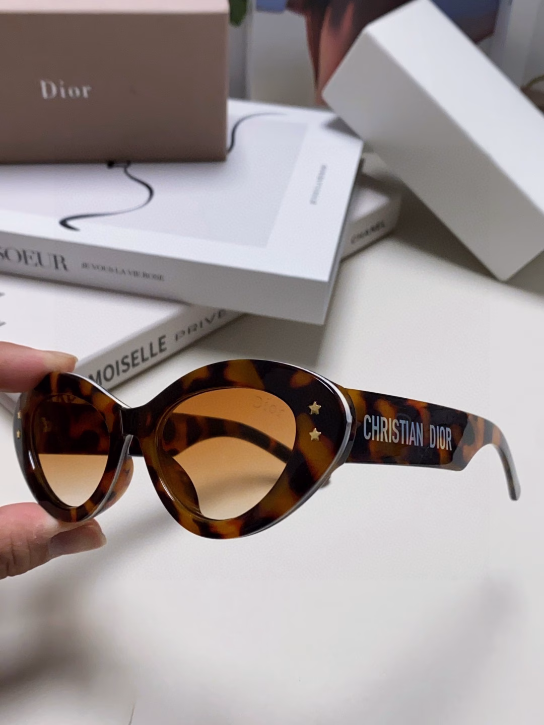 Dior cat-eye fashion sunglasses for womenClassic two-tone combinationGold-finish star hardware on the frontAcetate temples with 