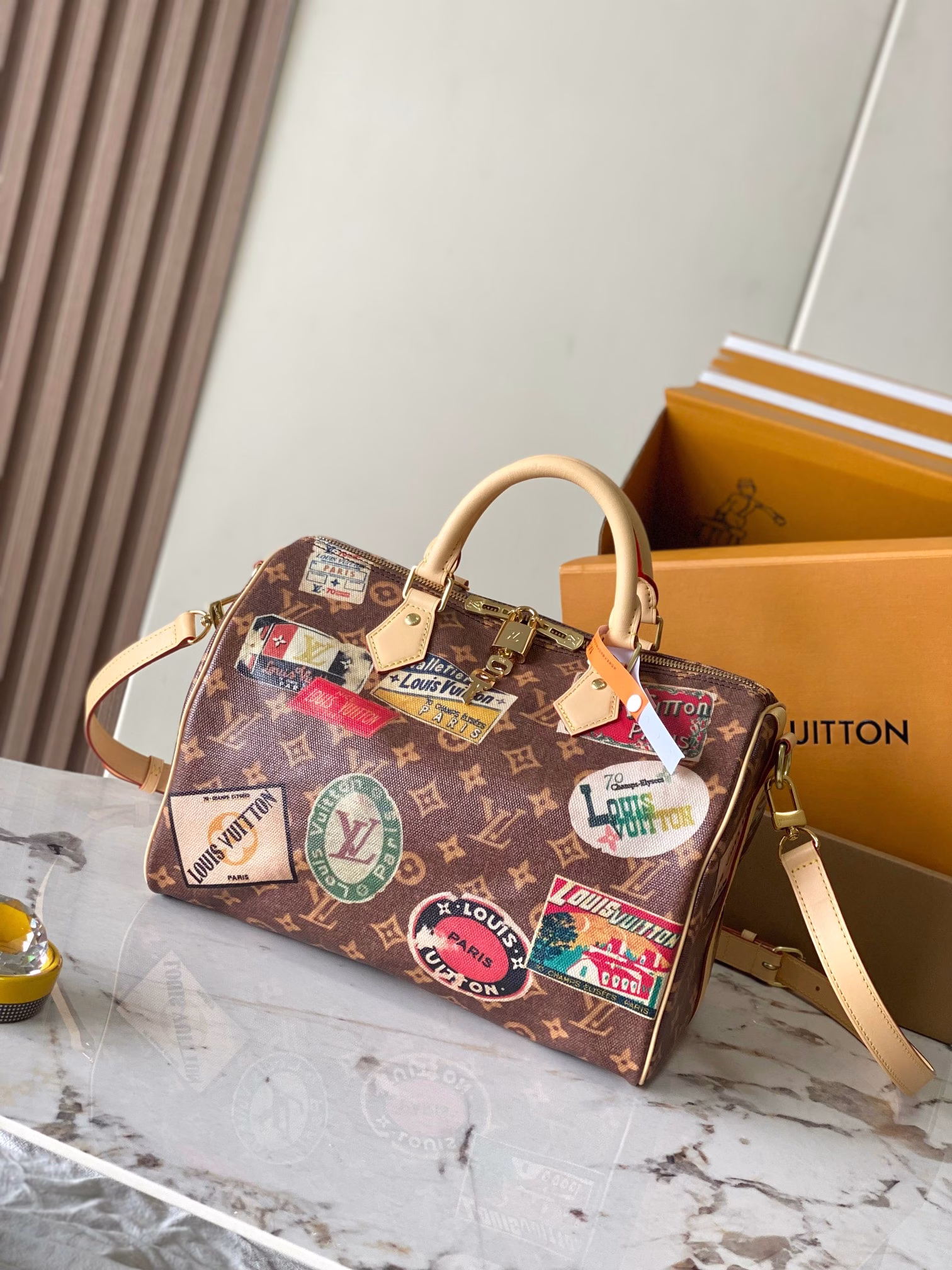 Speedy Bandouliere 30 handbagUsing resin lacquered cotton and linen blend to create a soft touch, inspired by the brand's classic hard case