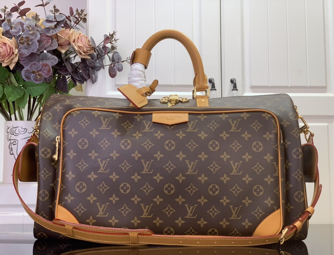 The Keepall Cargo 50 is a modern nod to the House's iconic design from the Monogram Archive collection. Made from Monogram coated canvas, it features distressed calfskin trims and striking hardware, while the main compartment and front pocket zipper pulls are embellished with metallic beads, a nod to Pharrell Williams's latest twist.