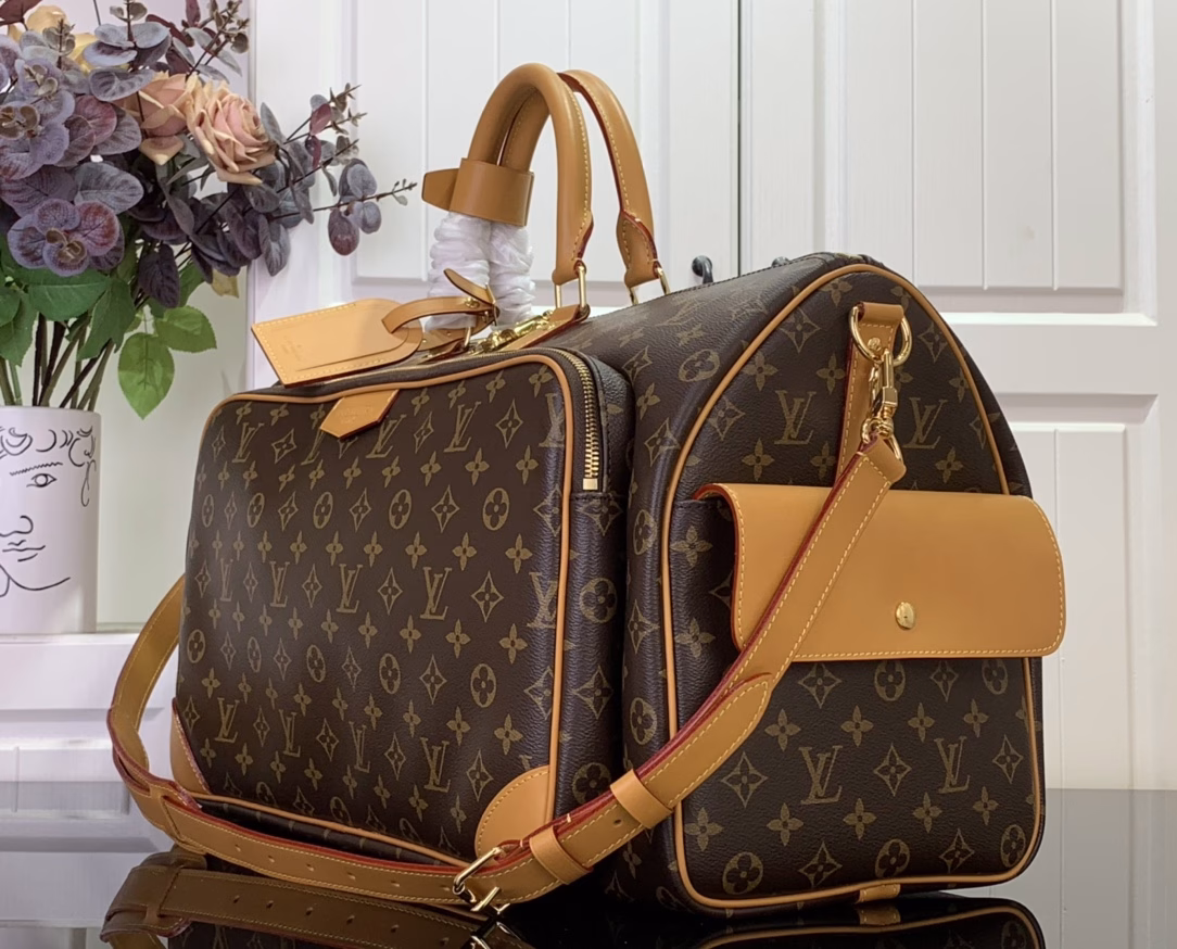 The Keepall Cargo 50 is a modern nod to the House's iconic design from the Monogram Archive collection. Made from Monogram coated canvas, it features distressed calfskin trims and striking hardware, while the main compartment and front pocket zipper pulls are embellished with metallic beads, a nod to Pharrell Williams's latest twist.