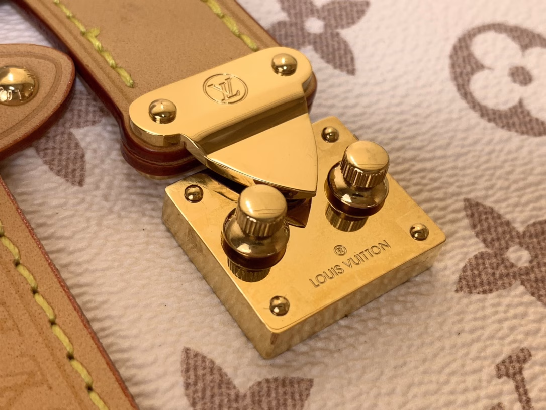 This Side Trunk Medium Bag is made from the brand's classic Monogram canvas, dyed in soft dune tones, and trimmed with cowhide leather for a visual contrast. The dazzling S-lock buckle and metal corners add a sophisticated touch