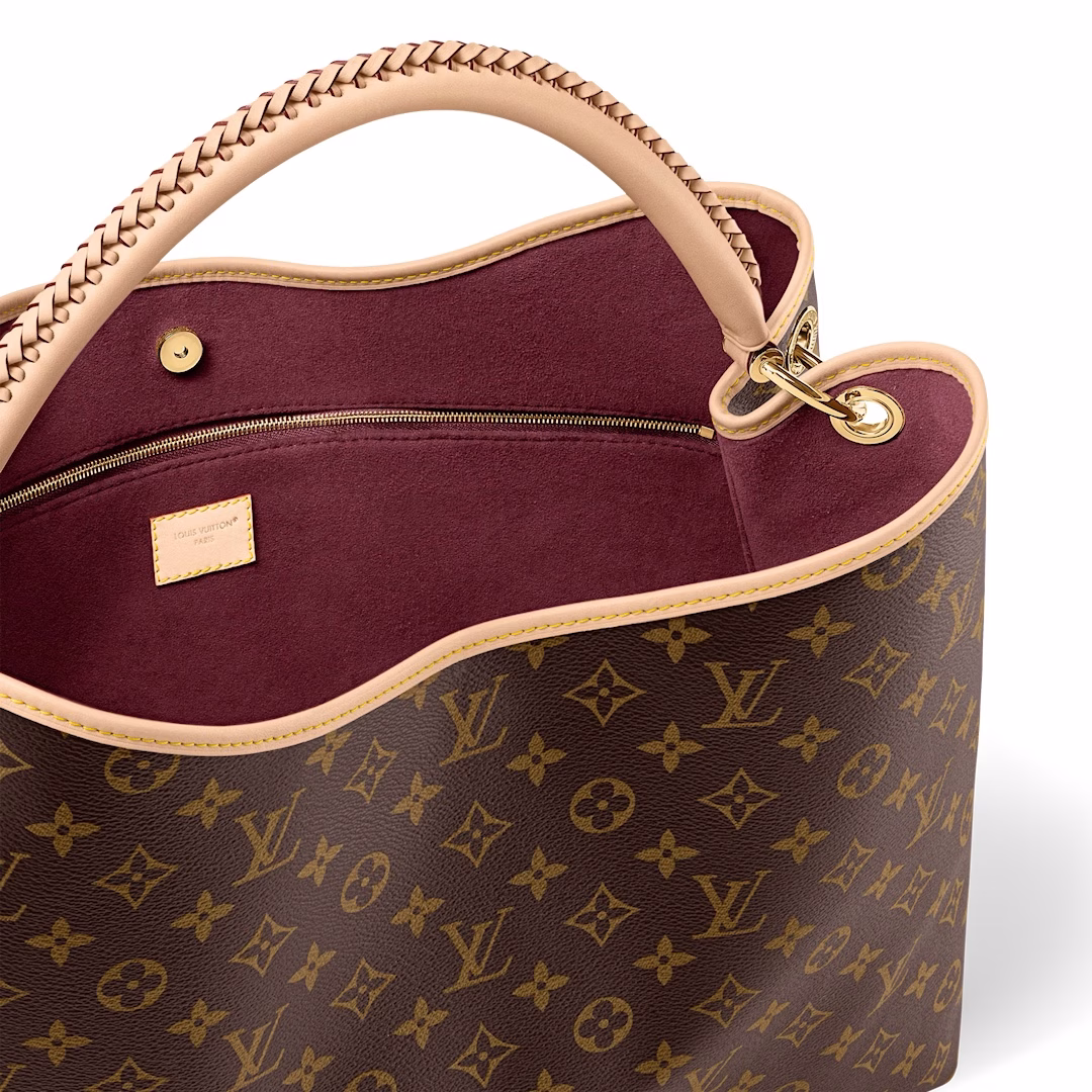 The Again bag is a current, more flexible and iconic reinterpretation of the Artsy model launched in 2010. This meticulously finished version is rooted in the house's heritage and pays homage to its expertise with Monogram canvas, hand-braided handles and a customizable address holder. The room is large enough to hold a laptop and has plenty of pockets. A gold carabiner allows you to attach a playful charm