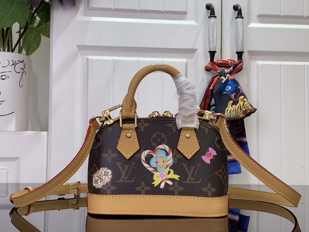 Inspired by the festive spirit of the Candy Factory collection, this Nano Alma bag features the brand's mascot, Vivienne, in a colorful pattern and leather charms that complement the vibrant lining. The Monogram canvas pays homage to the brand's heritage, creating a playful take on classic style.