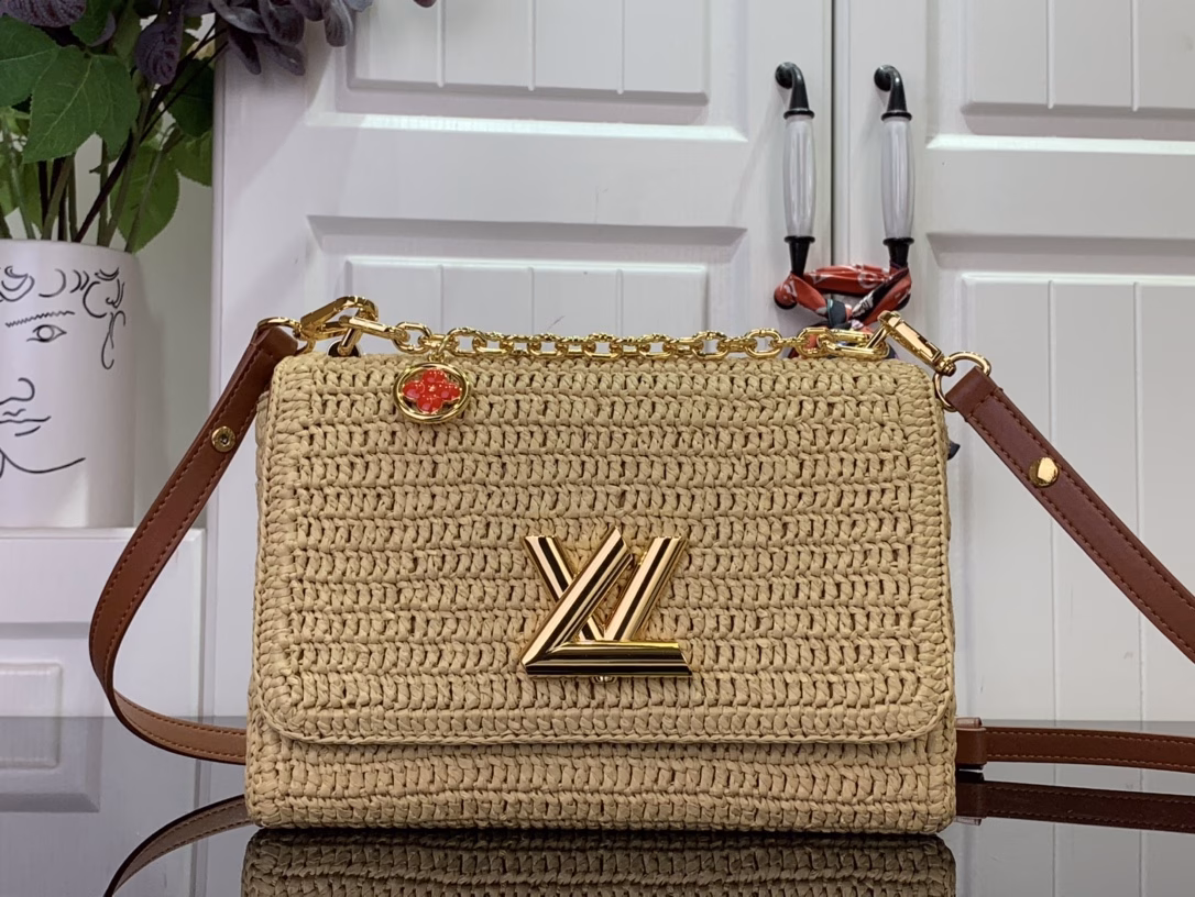 The Twist Slim Small Bag captures the relaxed style of the French Riviera and showcases the House's craftsmanship with a creative touch. The raffia body is trimmed with contrasting leather and features the iconic LV Twist lock, while the multiple pockets allow for organized storage and a removable mirror for added functionality.